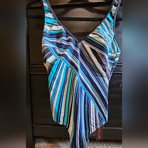 One piece bathing suit. Multi color. New. Never worn. Fits small. Girls 12
